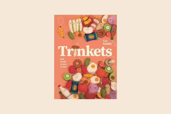 Book cover of 'Trinkets' with colorful illustrations on a pink background